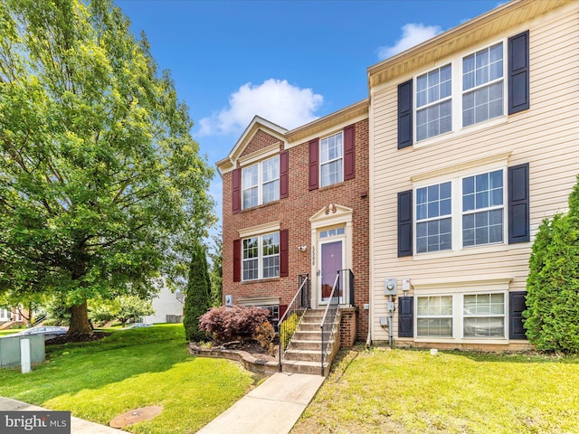 5500 Upshur Sq, Frederick, MD 21703 - townhome / multi-family property featuring a front yard and brick siding