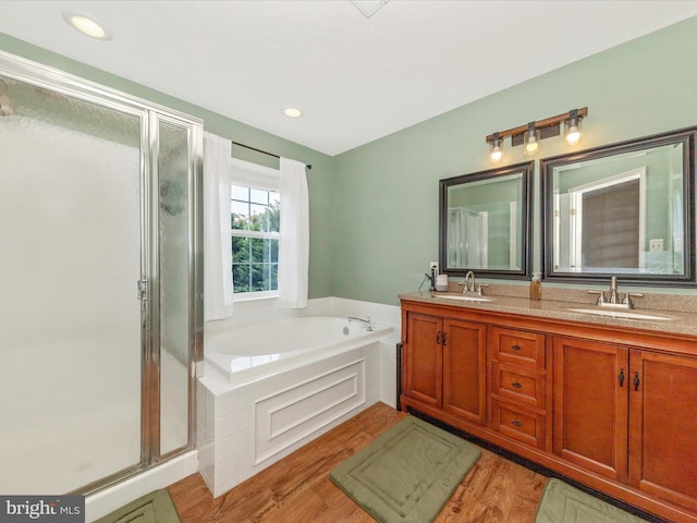 5500 Upshur Sq, Frederick, MD 21703 - full bath with a shower stall, a bath, wood finished floors, and double vanity
