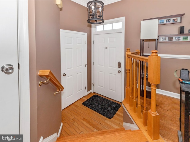 5500 Upshur Sq, Frederick, MD 21703 - entrance foyer featuring wood finished floors, a chandelier, and baseboards