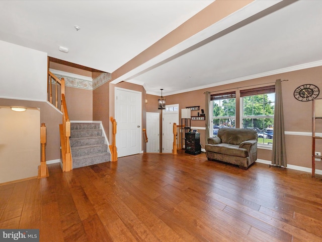 5500 Upshur Sq, Frederick, MD 21703 - living area featuring wood-type flooring, baseboards, stairway, ornamental molding, and a chandelier