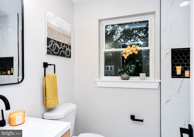 711 57th Pl NE, Washington, DC 20019 - bathroom featuring toilet and vanity