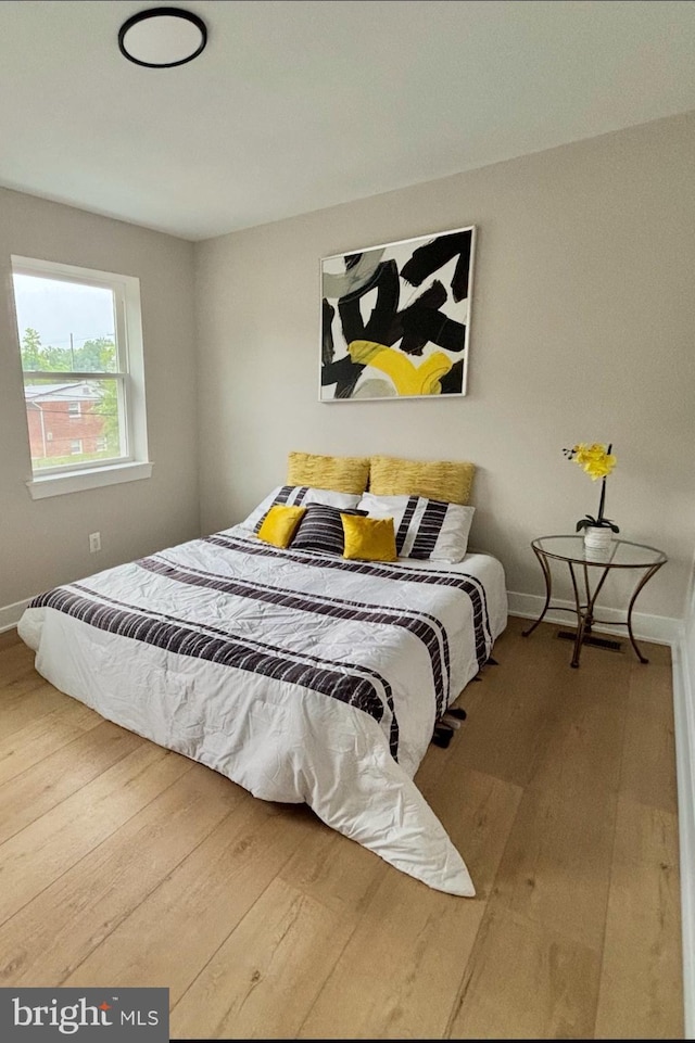 711 57th Pl NE, Washington, DC 20019 - bedroom with wood finished floors and baseboards