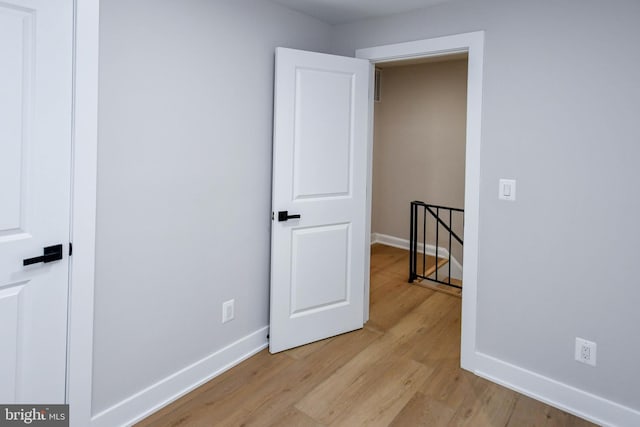 711 57th Pl NE, Washington, DC 20019 - unfurnished room with baseboards and light wood-style flooring