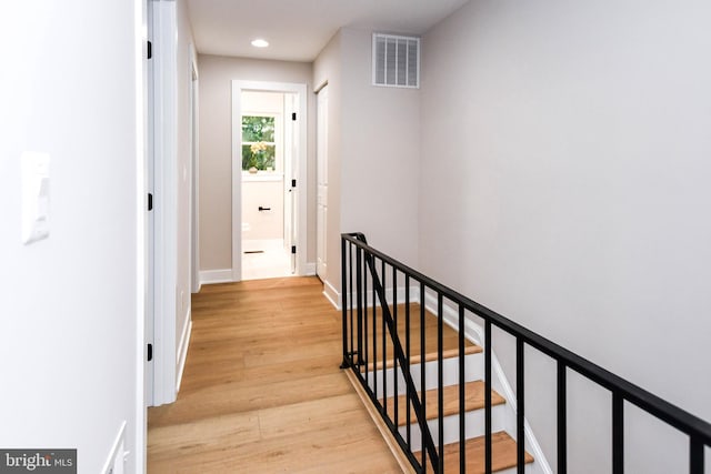 711 57th Pl NE, Washington, DC 20019 - hall with an upstairs landing, recessed lighting, light wood-style floors, and baseboards