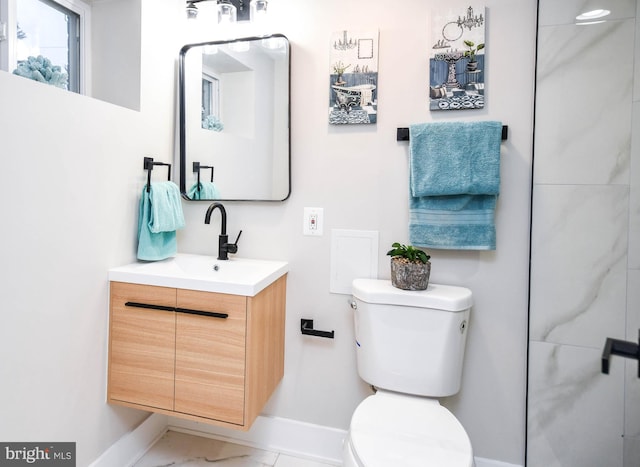 711 57th Pl NE, Washington, DC 20019 - bathroom with baseboards, toilet, vanity, and marble finish floors