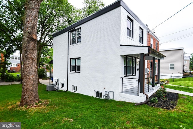 711 57th Pl NE, Washington, DC 20019 - view of home's exterior with brick siding and central AC unit