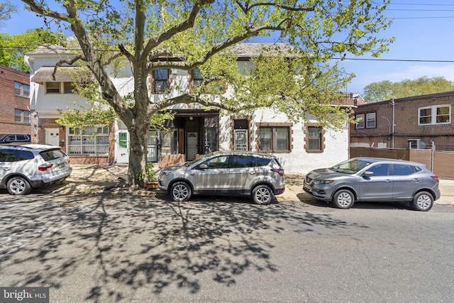 townhome / multi-family property featuring brick siding