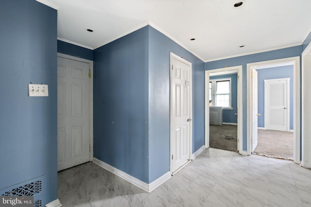 entryway featuring baseboards and ornamental molding