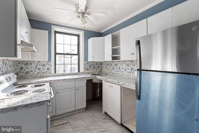 kitchen with white appliances, open shelves, light countertops, and tasteful backsplash
