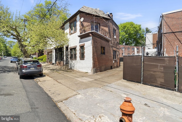 view of side of property with brick siding