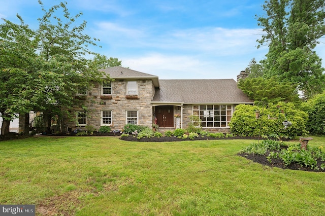 1 Locust Ln, Media, PA 19063 - tri-level home featuring stone siding, a front yard, a shingled roof, and a chimney