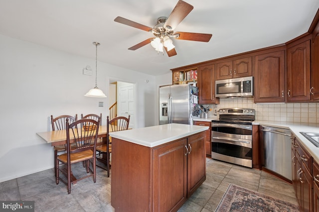 1 Locust Ln, Media, PA 19063 - kitchen featuring appliances with stainless steel finishes, backsplash, ceiling fan, and light countertops