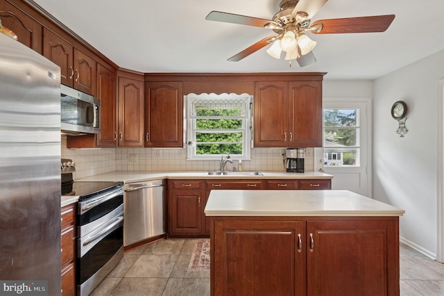 1 Locust Ln, Media, PA 19063 - kitchen with appliances with stainless steel finishes, plenty of natural light, a sink, and backsplash
