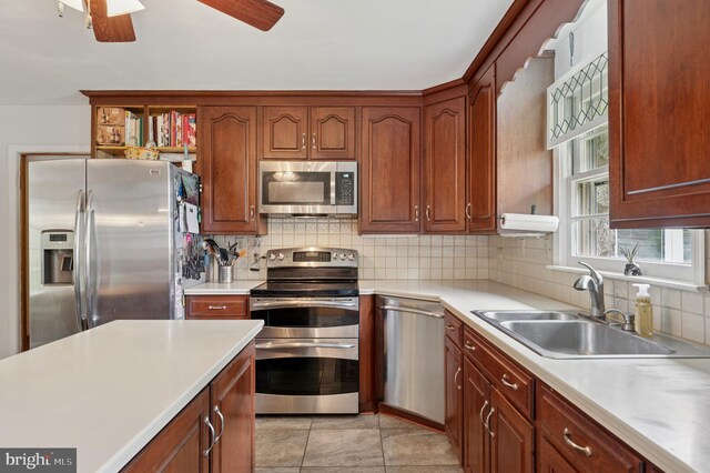 1 Locust Ln, Media, PA 19063 - kitchen featuring appliances with stainless steel finishes, a sink, light countertops, tasteful backsplash, and a ceiling fan