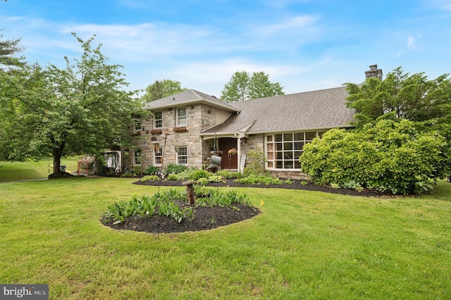 1 Locust Ln, Media, PA 19063 - view of front of house featuring stone siding, a front lawn, a chimney, and roof with shingles
