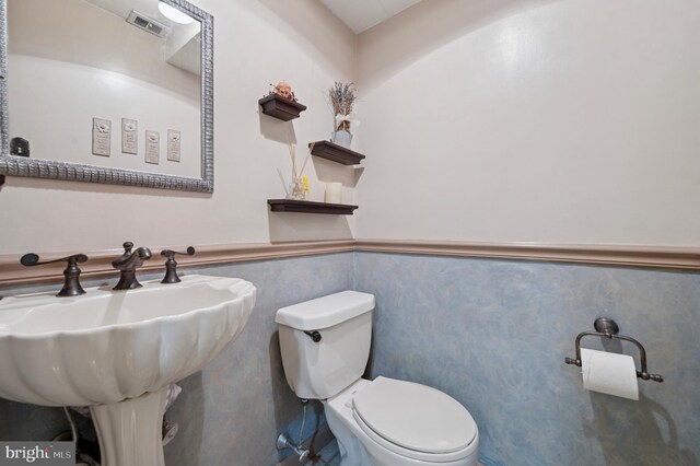 1 Locust Ln, Media, PA 19063 - bathroom with toilet, a wainscoted wall, and a sink