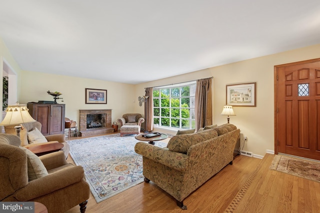 1 Locust Ln, Media, PA 19063 - living room with light wood-style flooring, baseboards, and a brick fireplace