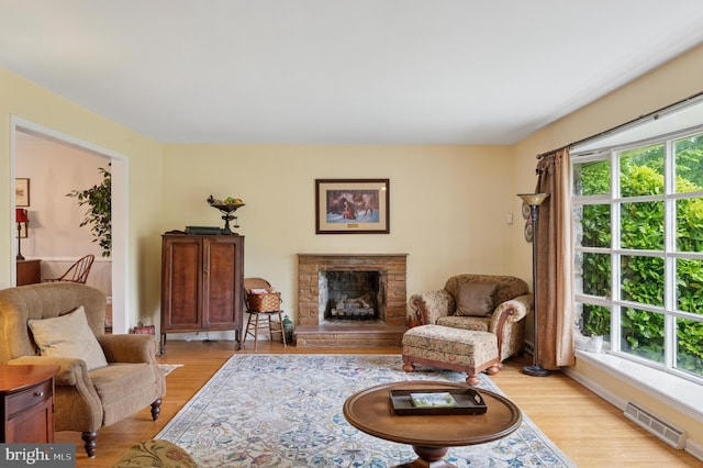 1 Locust Ln, Media, PA 19063 - living room featuring light wood-type flooring and a fireplace with raised hearth
