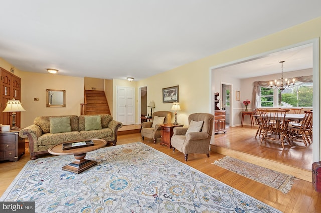 1 Locust Ln, Media, PA 19063 - living room featuring stairs, light wood-style floors, and a chandelier