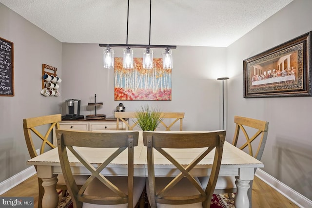 5904 Mount Eagle Dr Unit 1003, Alexandria, VA 22303 - dining room with wood finished floors, baseboards, and a textured ceiling