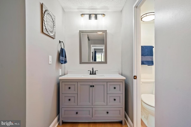 5904 Mount Eagle Dr Unit 1003, Alexandria, VA 22303 - bathroom with a textured ceiling, vanity, and toilet