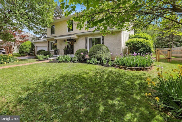 89 Wellington Blvd, Wyomissing, PA 19610 - traditional-style home featuring a garage and brick siding