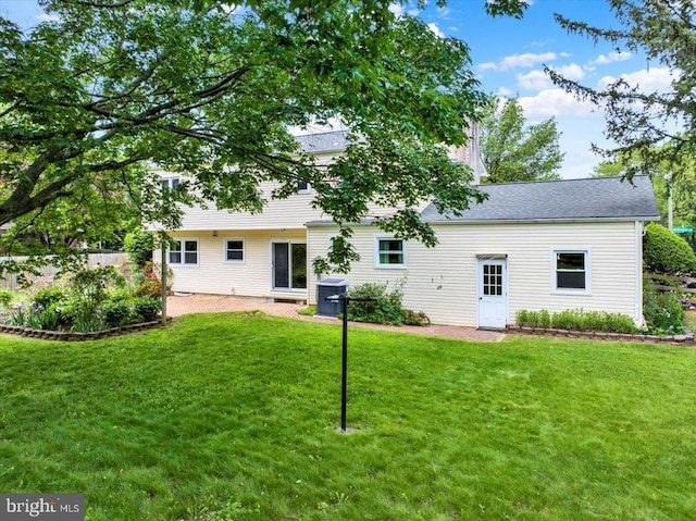 89 Wellington Blvd, Wyomissing, PA 19610 - rear view of house featuring a yard