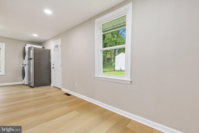 1106 Fiji Ave, Landover, MD 20785 - kitchen with freestanding refrigerator, baseboards, light wood finished floors, and recessed lighting