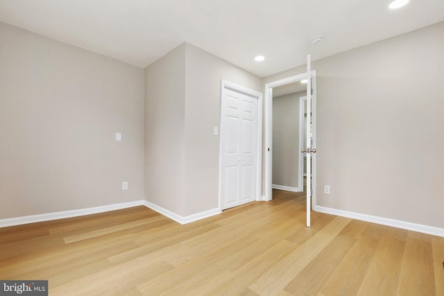 1106 Fiji Ave, Landover, MD 20785 - spare room featuring light wood-style floors, baseboards, recessed lighting, and a smoke detector