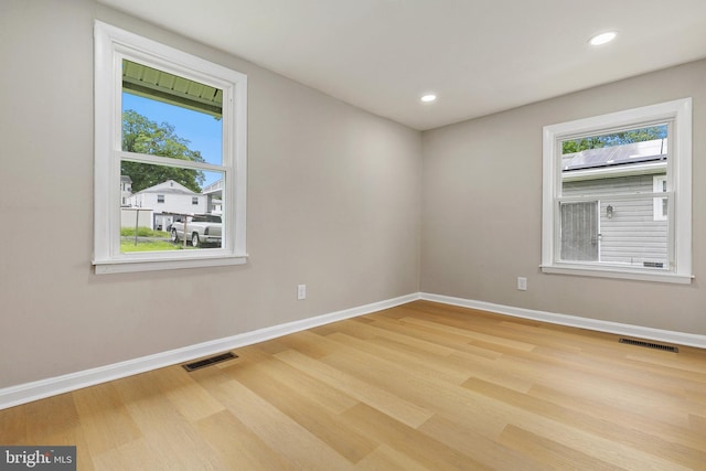1106 Fiji Ave, Landover, MD 20785 - empty room with wood finished floors, baseboards, healthy amount of natural light, and recessed lighting
