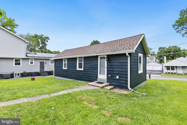 1106 Fiji Ave, Landover, MD 20785 - view of front of home with entry steps, a front lawn, central AC, and roof with shingles