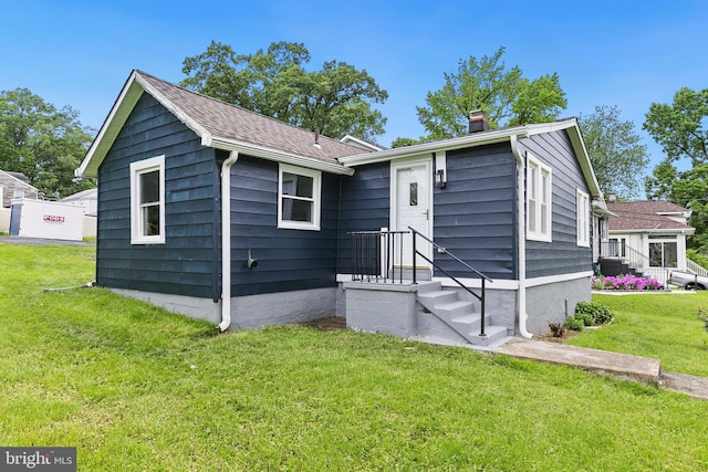 1106 Fiji Ave, Landover, MD 20785 - view of front of home featuring a chimney and a front yard