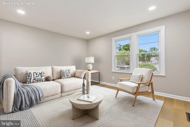 1106 Fiji Ave, Landover, MD 20785 - living room featuring baseboards, recessed lighting, and light wood finished floors
