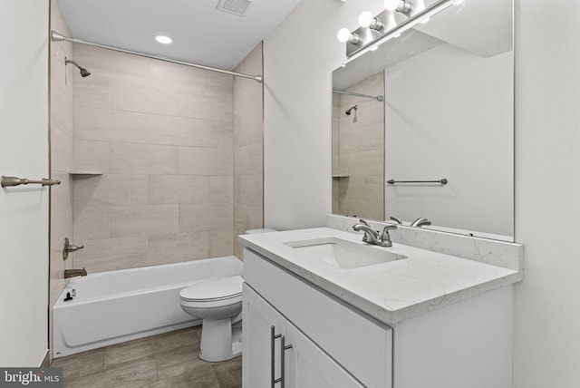 full bath featuring toilet, vanity, tub / shower combination, and recessed lighting