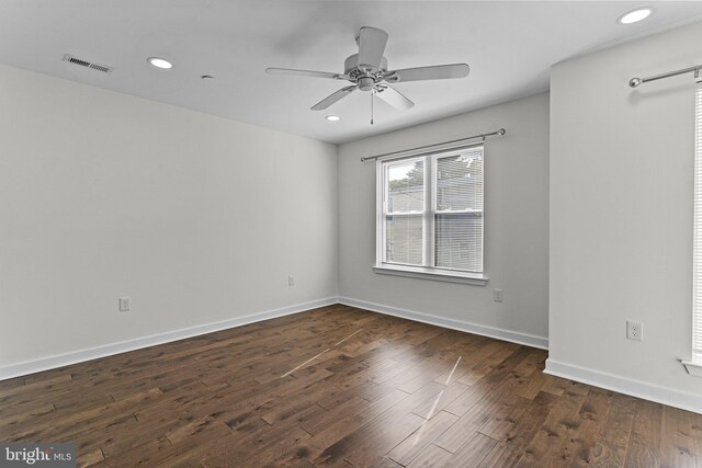 spare room with dark wood-style floors, a ceiling fan, baseboards, and recessed lighting