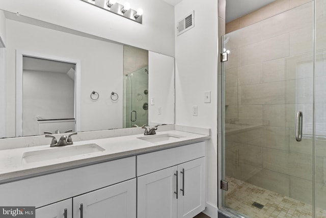 full bath with double vanity and a stall shower