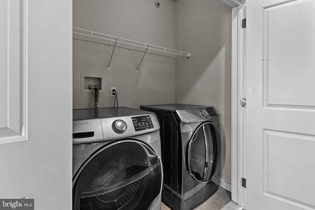 washroom with washer and dryer