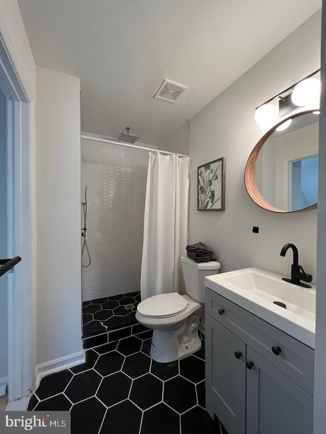 8118 Chapel Cove Dr, Laurel, MD 20707 - bathroom featuring a shower with curtain, vanity, toilet, and tile patterned flooring