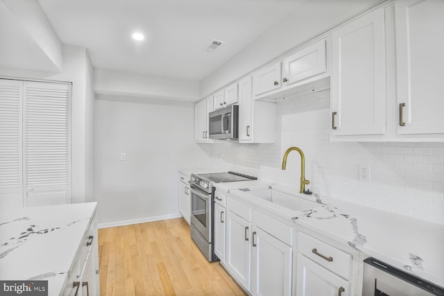 8118 Chapel Cove Dr, Laurel, MD 20707 - kitchen with appliances with stainless steel finishes, a sink, beverage cooler, backsplash, and recessed lighting