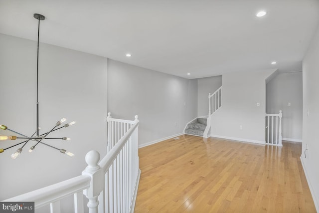 8118 Chapel Cove Dr, Laurel, MD 20707 - unfurnished room featuring light wood-style flooring, recessed lighting, a chandelier, and baseboards
