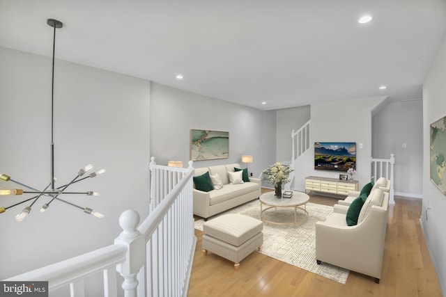 8118 Chapel Cove Dr, Laurel, MD 20707 - living room with light wood finished floors, recessed lighting, a chandelier, and stairway