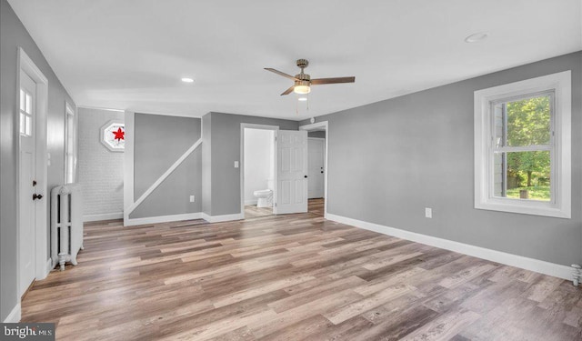212 Broad St, Elmer, NJ 08318 - unfurnished bedroom with radiator, baseboards, wood finished floors, and recessed lighting
