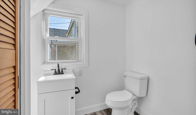 212 Broad St, Elmer, NJ 08318 - half bath featuring baseboards, toilet, vanity, and wood finished floors