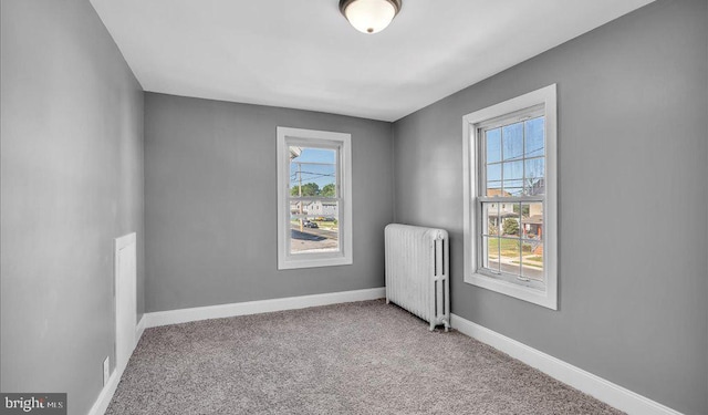 212 Broad St, Elmer, NJ 08318 - carpeted spare room with radiator and baseboards