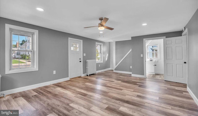 212 Broad St, Elmer, NJ 08318 - entryway featuring radiator, ceiling fan, baseboards, wood finished floors, and recessed lighting