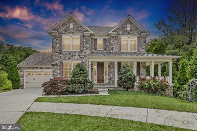 9830 Forge Valley Ct, Perry Hall, MD 21128 - view of front facade featuring a garage, driveway, a front lawn, a porch, and stone siding