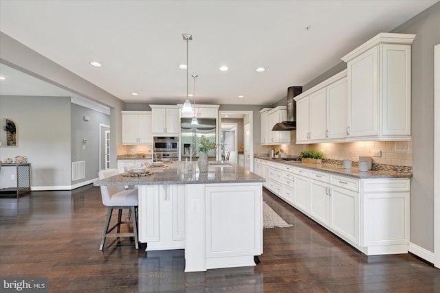 9830 Forge Valley Ct, Perry Hall, MD 21128 - kitchen with wall chimney exhaust hood, stainless steel appliances, backsplash, white cabinets, and baseboards