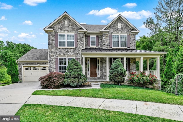 9830 Forge Valley Ct, Perry Hall, MD 21128 - view of front of house featuring an attached garage, concrete driveway, a front lawn, and stone siding