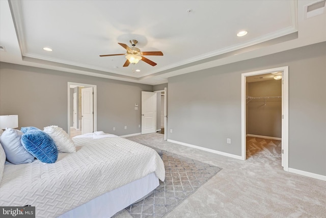 9830 Forge Valley Ct, Perry Hall, MD 21128 - carpeted bedroom featuring a raised ceiling, baseboards, a spacious closet, recessed lighting, and crown molding