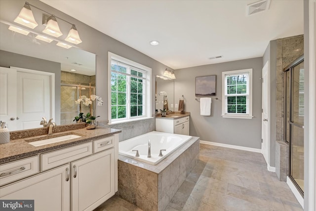 9830 Forge Valley Ct, Perry Hall, MD 21128 - full bath featuring a shower stall, two vanities, and a garden tub
